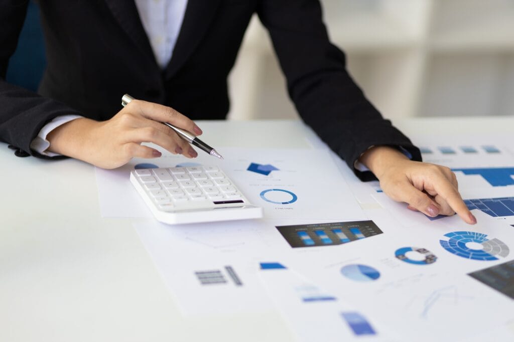 Businesswoman working with documents and analyzing business investment and financial accounting.