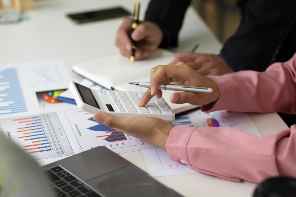 Meeting discussion calculation and analysis of financial statement accounting data on the office.