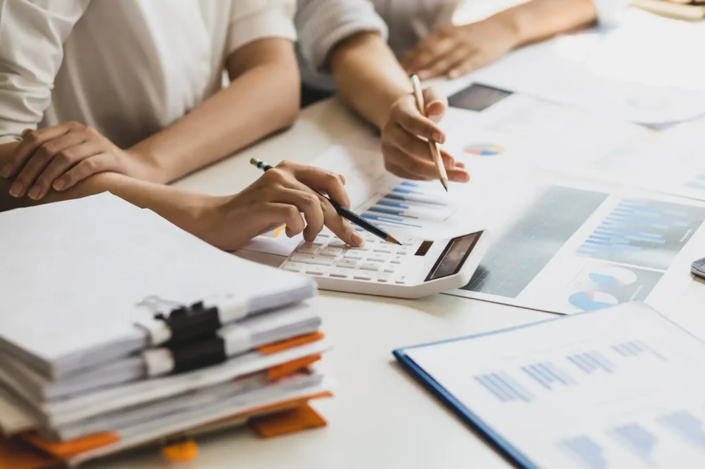 Businesswoman colleague discuss planning, budget management, accounting, business in office