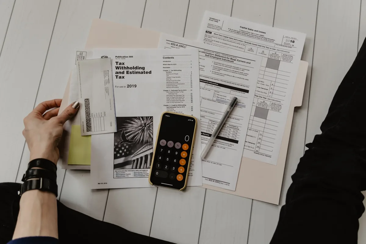 Annual accounting paperwork beside a calculator