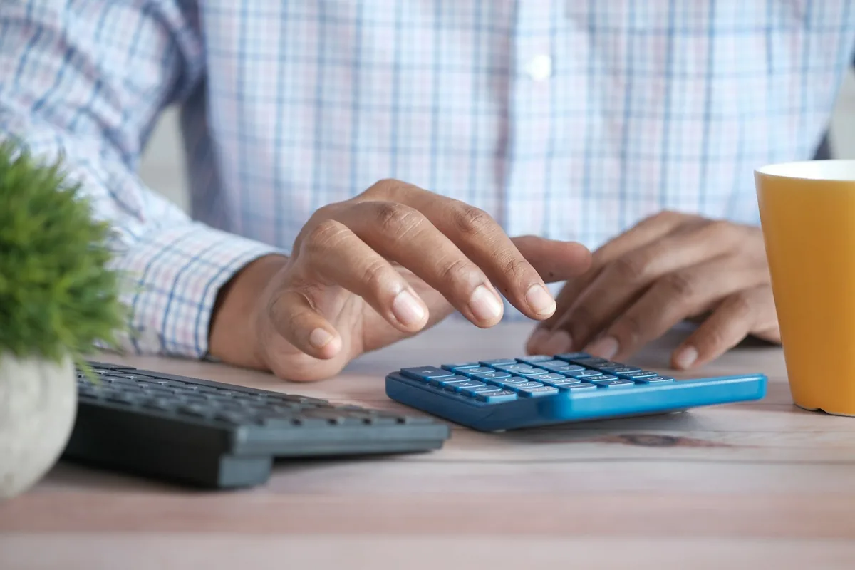 Business owner calculating company finances