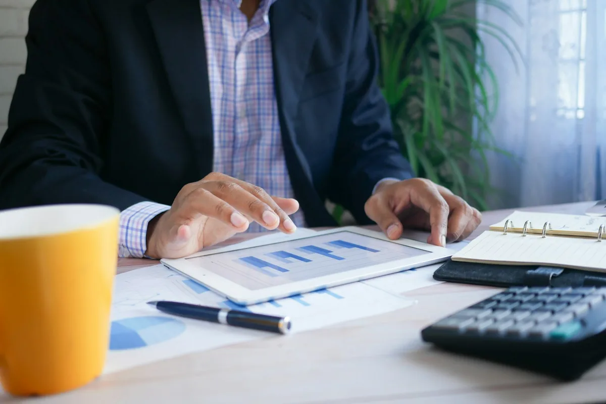 Executive reviewing company information on a tablet