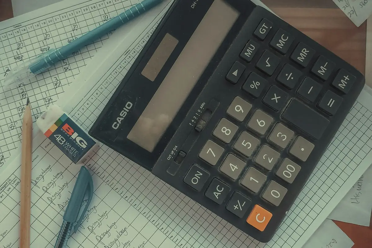 Calculator resting on corporate financial papers