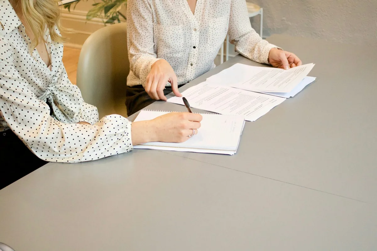 Family representatives signing estate documents