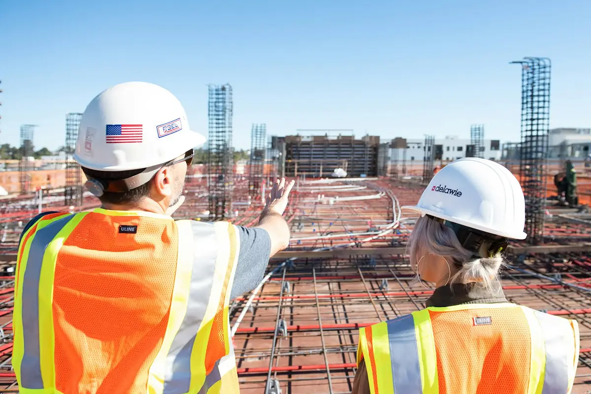 Construction team coordinating work on site