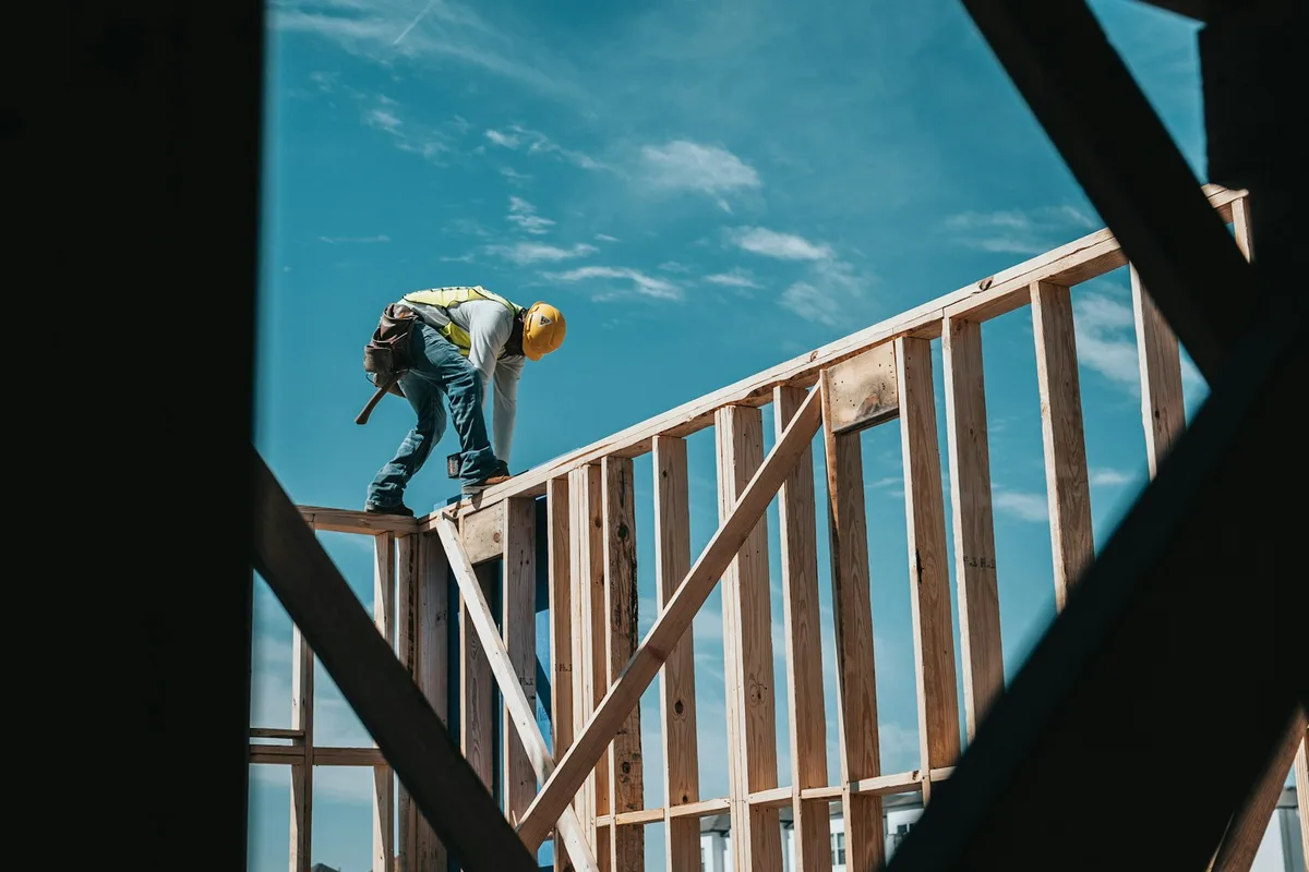 Construction worker on a building frame