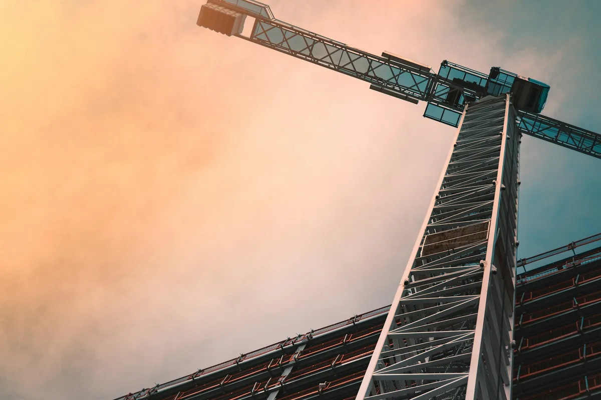Tower crane above an active construction site