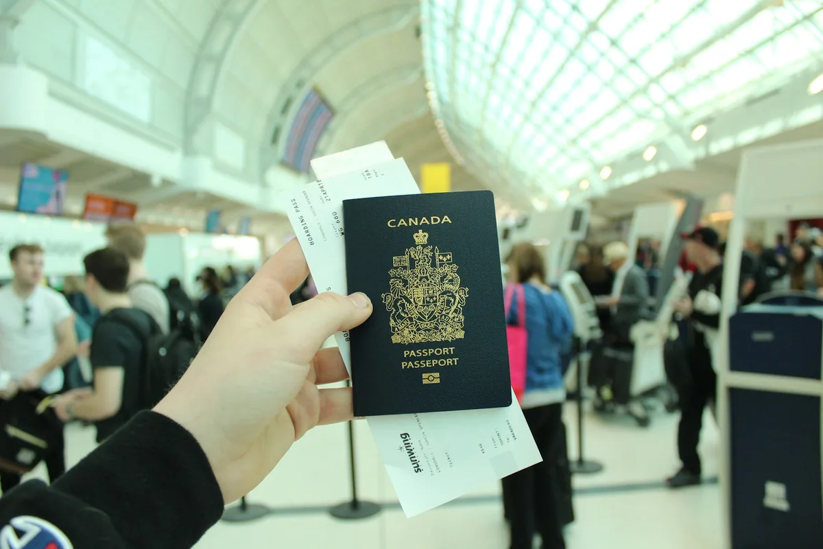 Traveler holding a Canadian passport