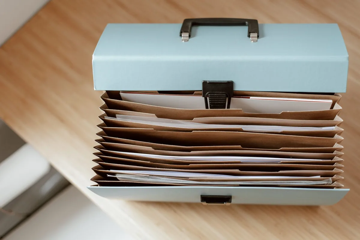 Organized case documents and folders on a wooden desk