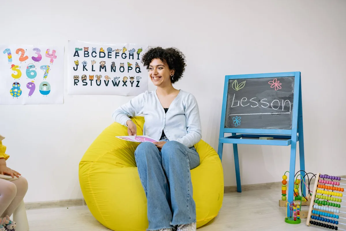 Preschool teacher working with children in a classroom