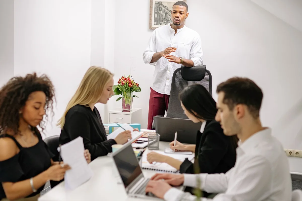 Colleagues discussing workplace savings benefits