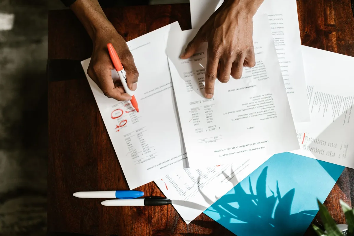 Person reviewing financial documents before filing an objection