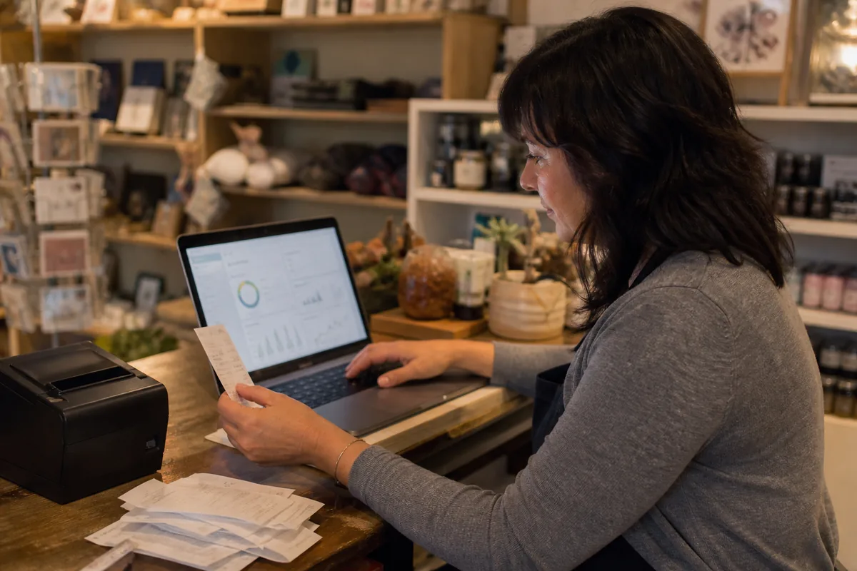Retail owner reconciling cloud accounting records