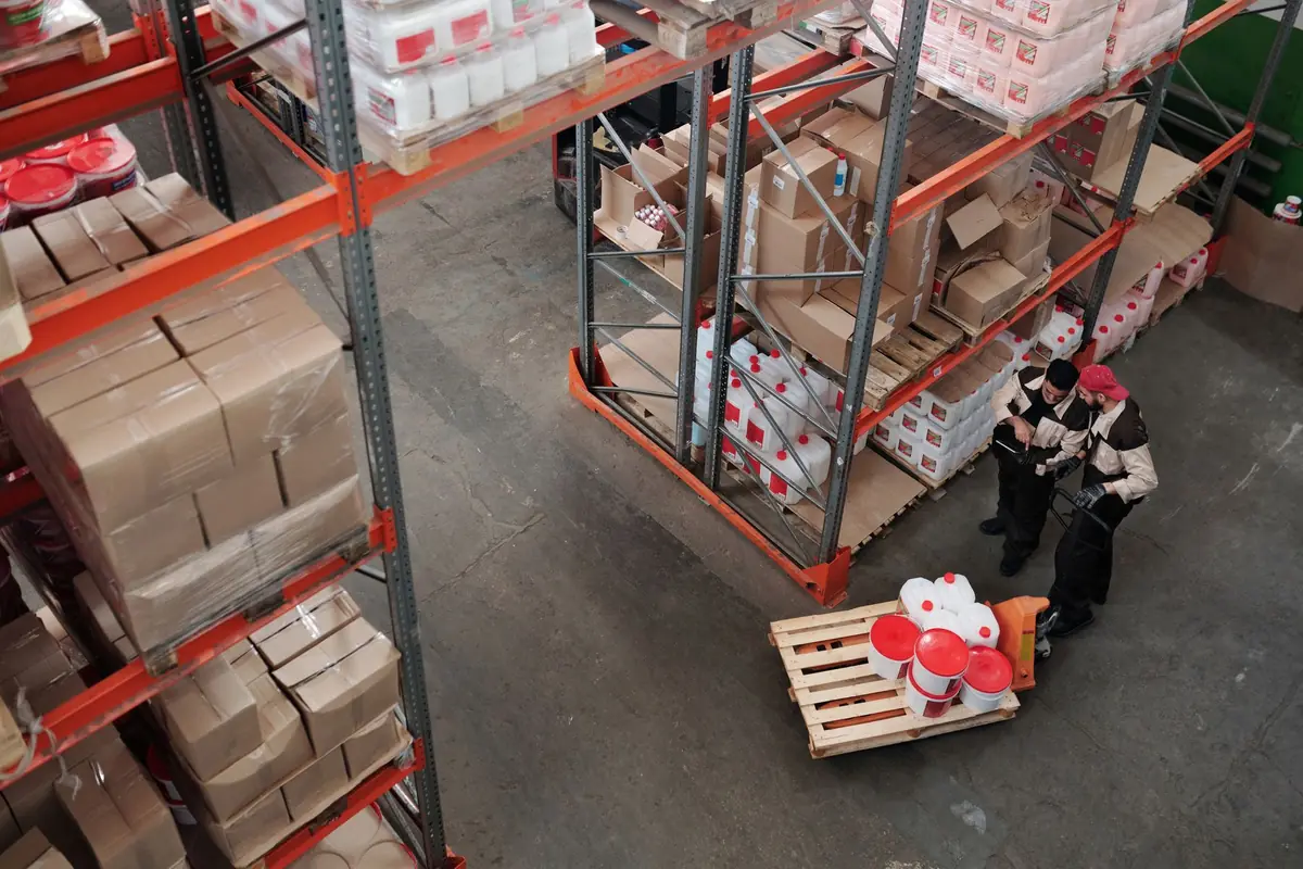 Warehouse workers checking stored inventory