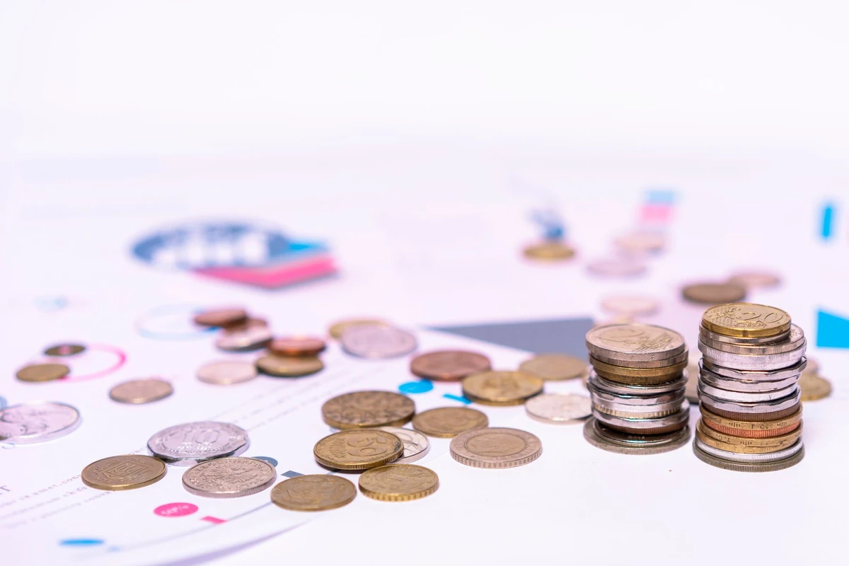Coins arranged with financial documents