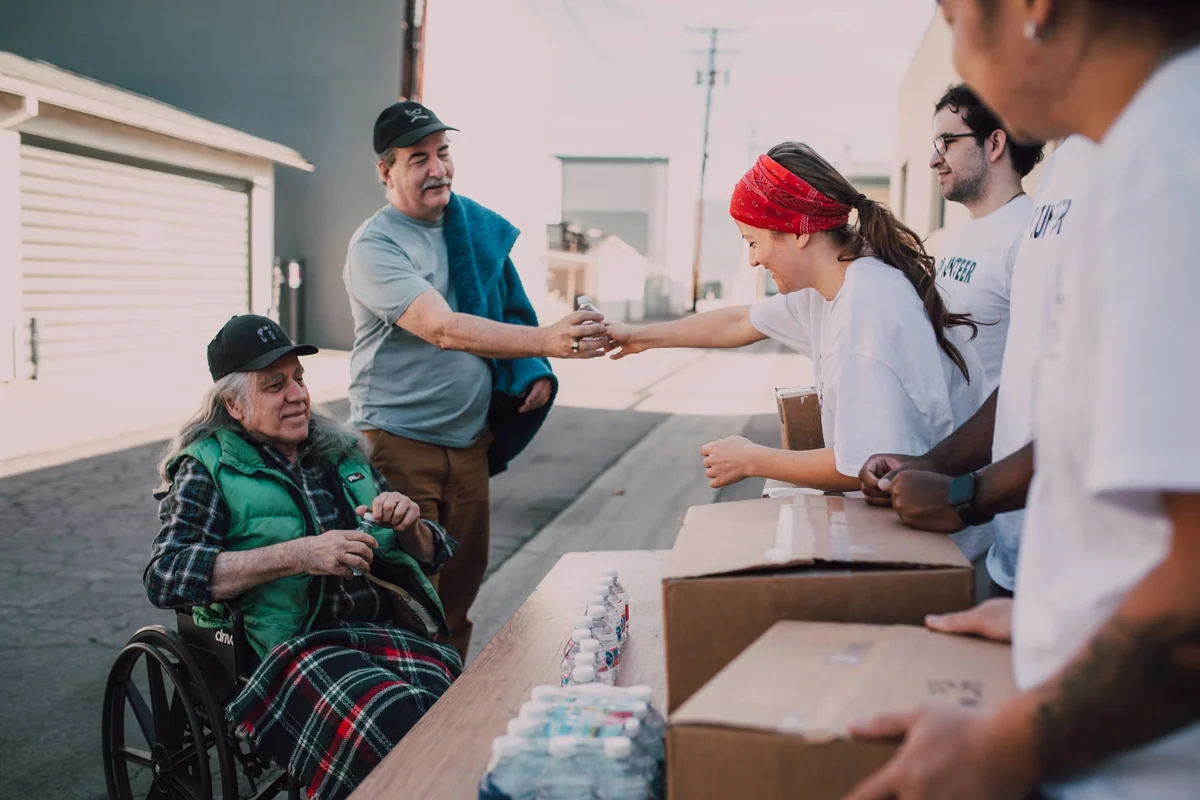 Volunteers distributing supplies in the community