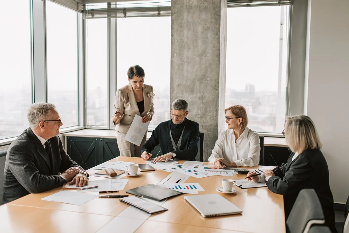 Employer and employee reviewing workplace documents