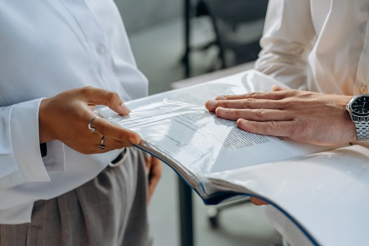 Business professionals reviewing financial documents