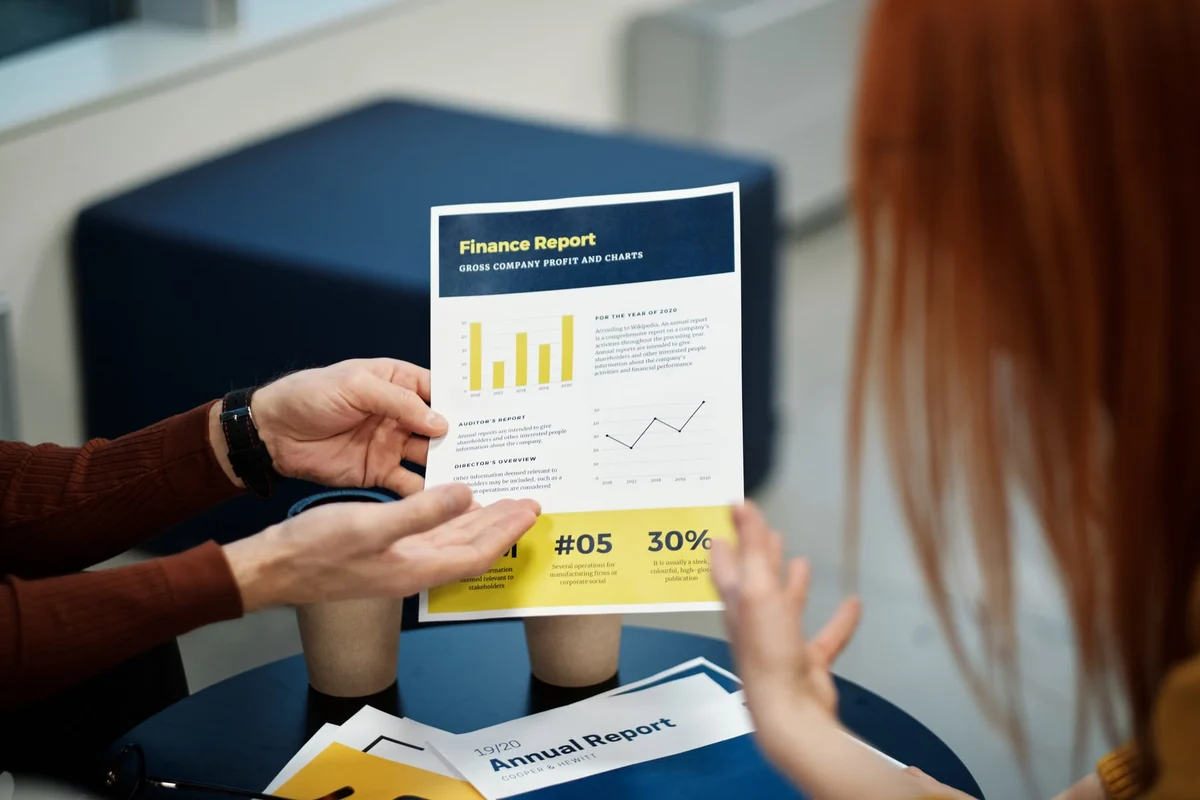 Business professionals reviewing a corporate financial report