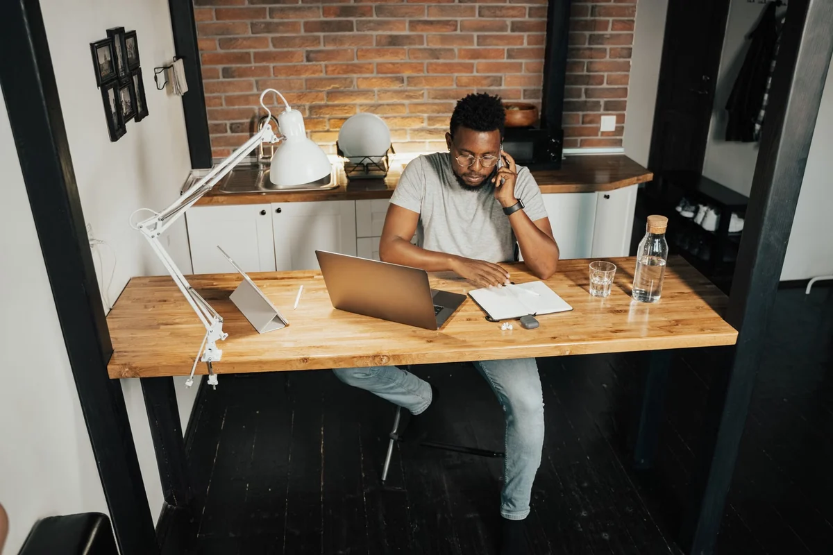 Employee working at a desk in a home office