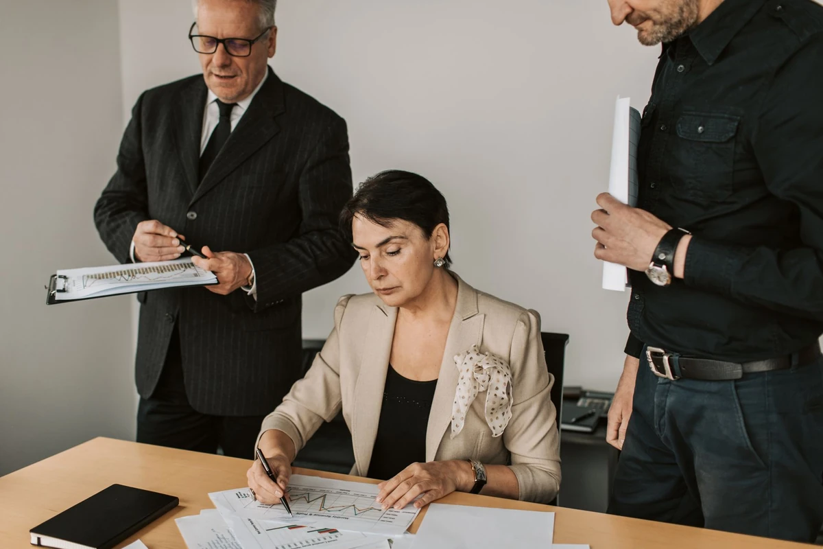 Business professionals discussing financial documents