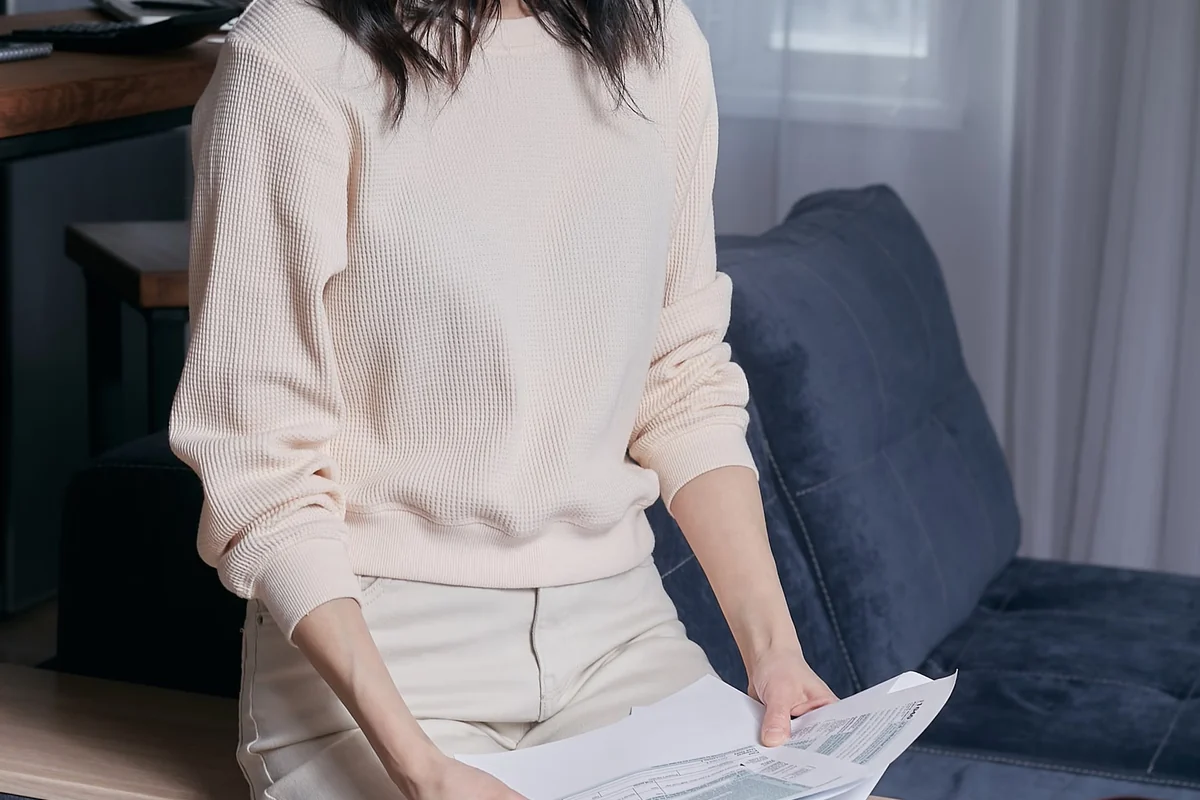 Taxpayer reading assessment documents at home