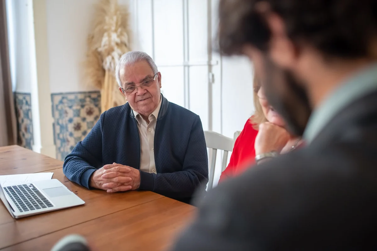Business owner consulting with financial advisors about compensation
