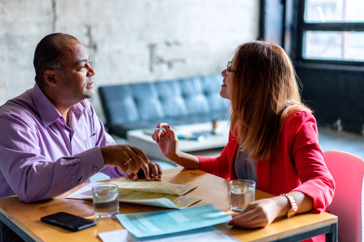 Business partners discussing documents in an office