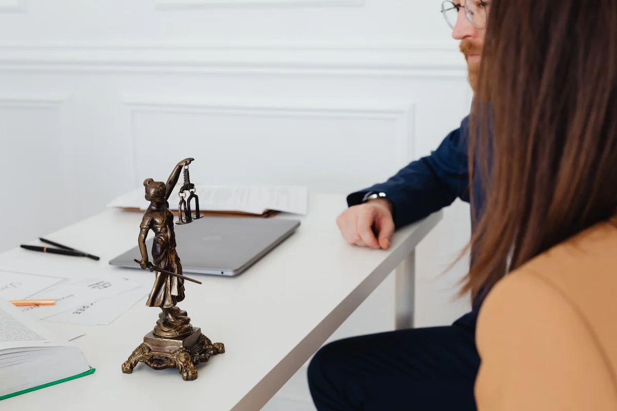 Couple reviewing estate planning documents in a lawyer's office