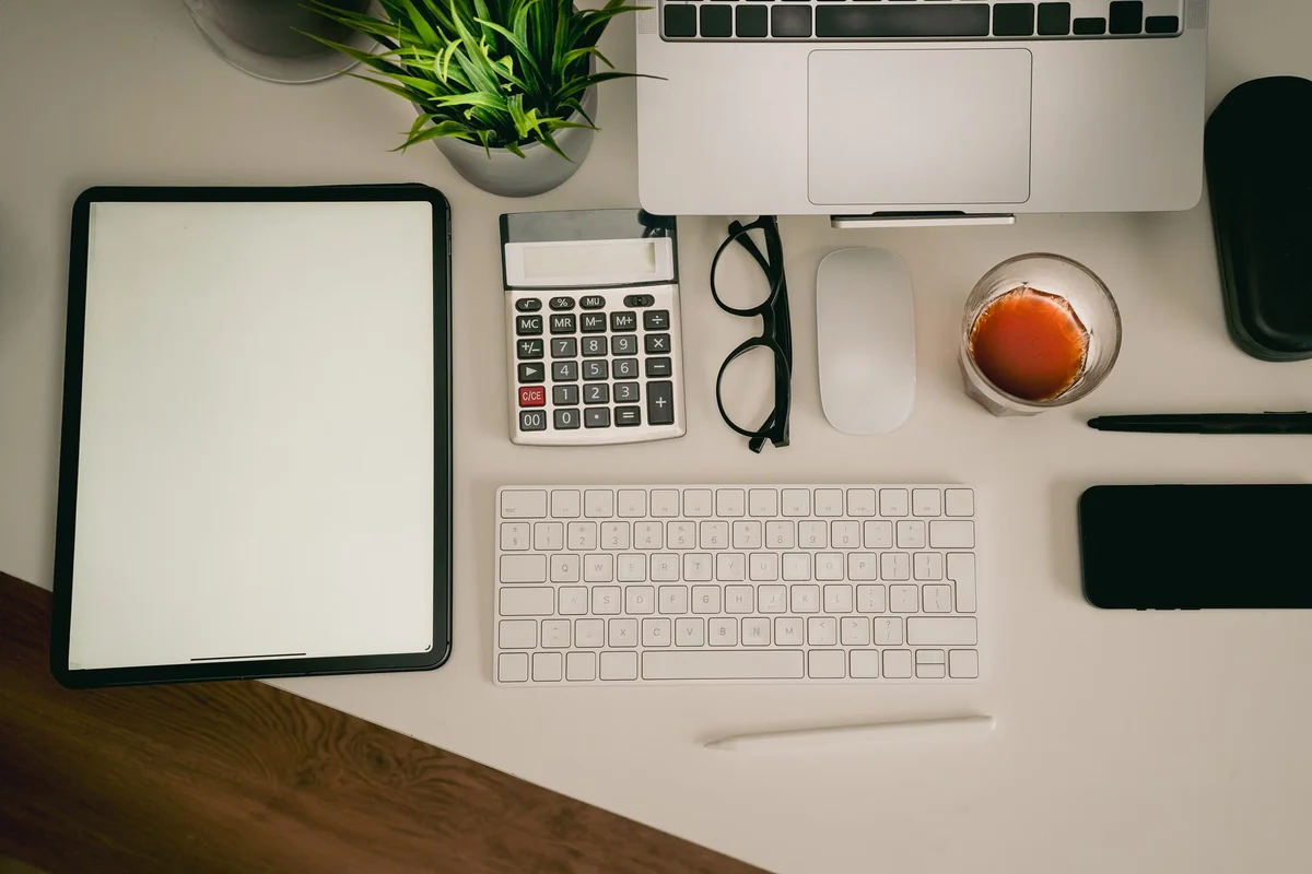 Organized home office workspace with supplies and calculator