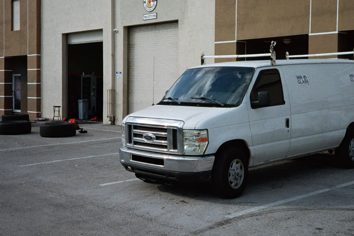 Commercial work van parked outside a warehouse