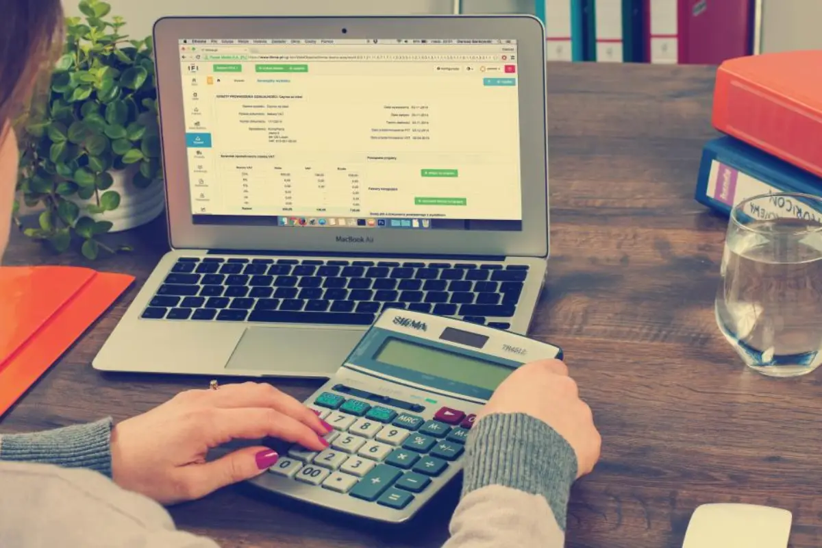Working out how much to pay in tax instalments using a laptop spreadsheet and calculator