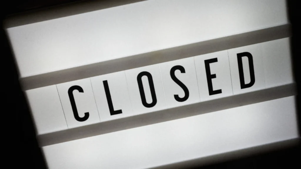 Lightbox sign reading CLOSED, representing dissolving a corporation in BC