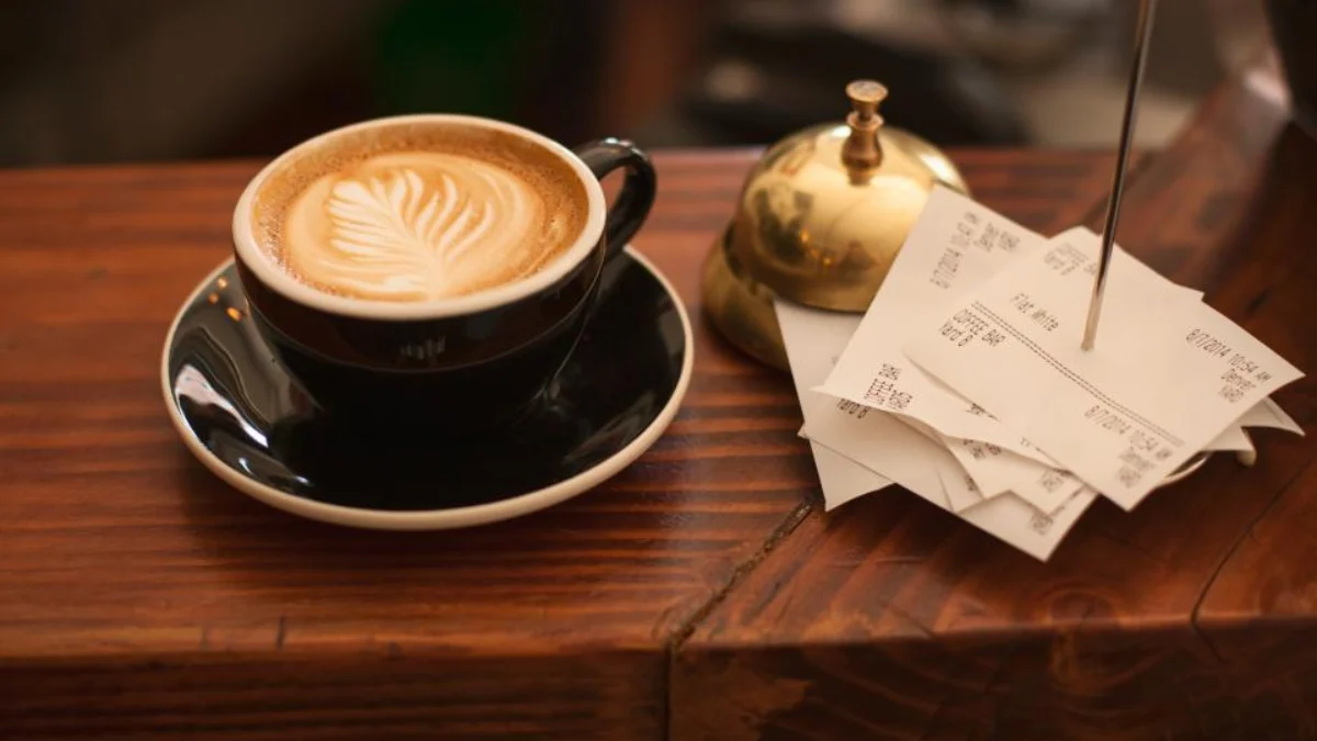 Coffee and a stack of receipts kept to support GST/HST input tax credit claims