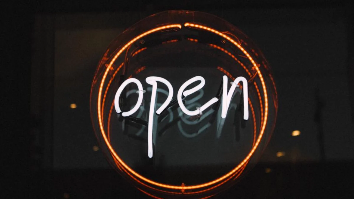 Neon OPEN sign for a newly registered Alberta business