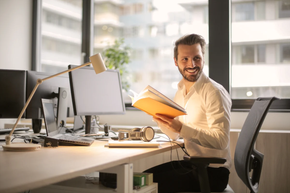 Business owner at his desk reviewing what to do with retained earnings