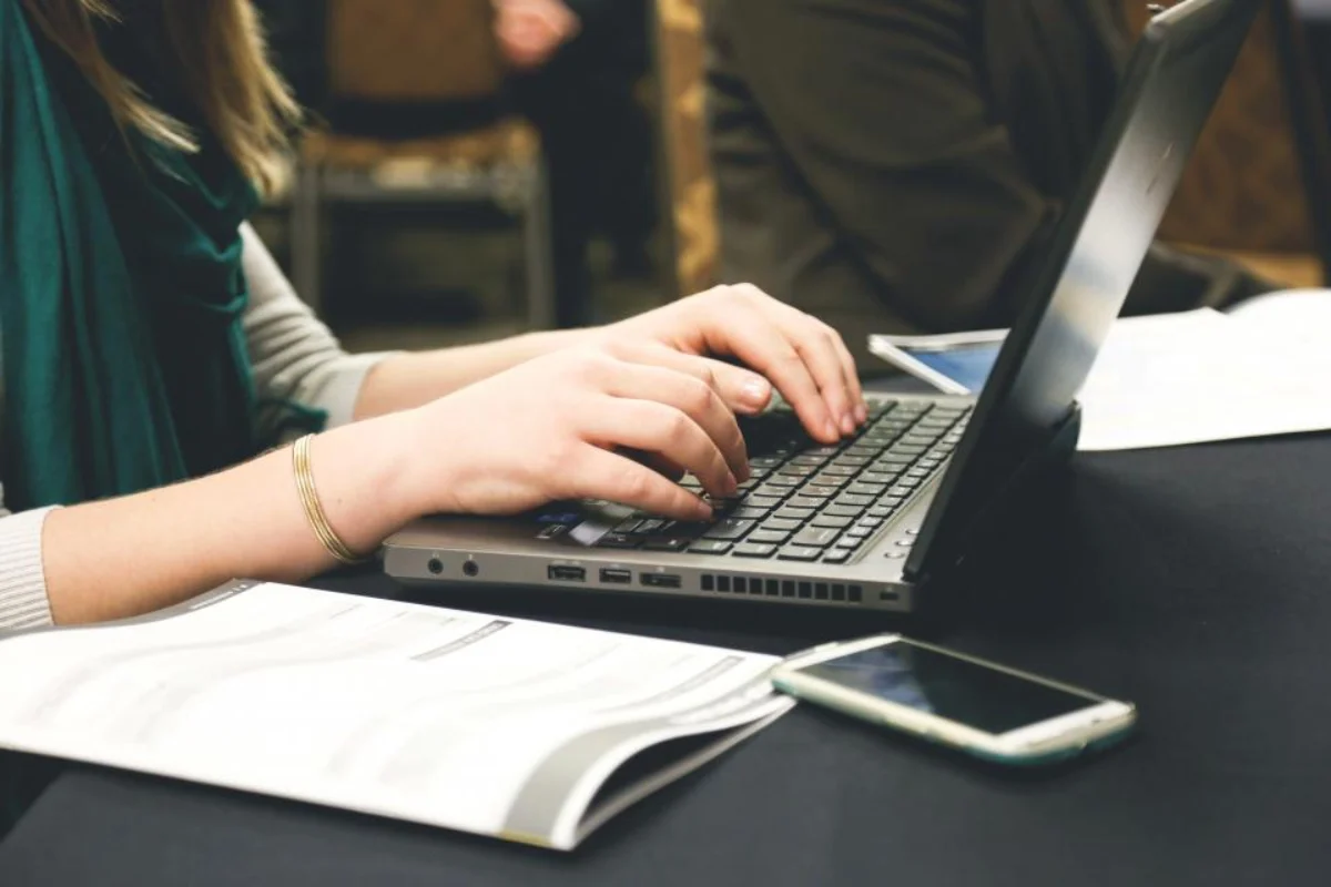 Business owner filing a Saskatchewan PST return on a laptop