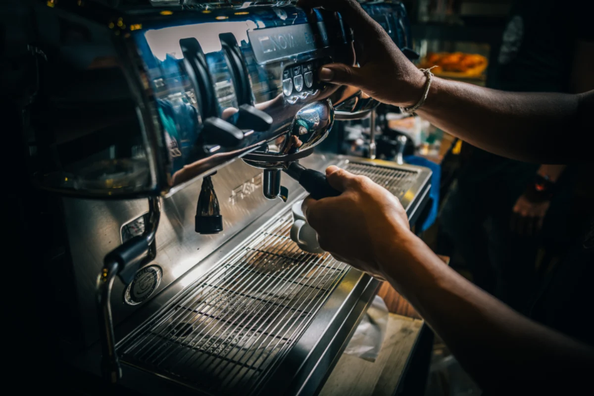 Barista working an espresso machine on a statutory holiday shift